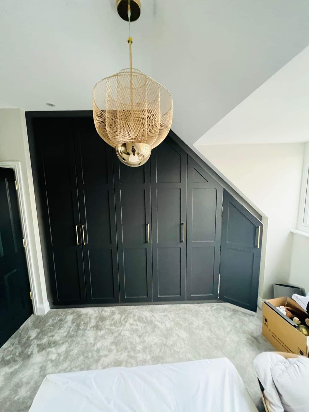 Bespoke matt grey loft fitted wardrobes in a Manchester home