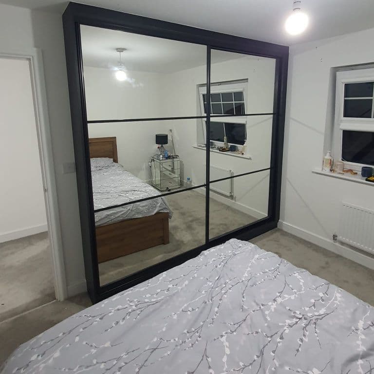 Contemporary sliding door fitted bedroom furniture in a Manchester home