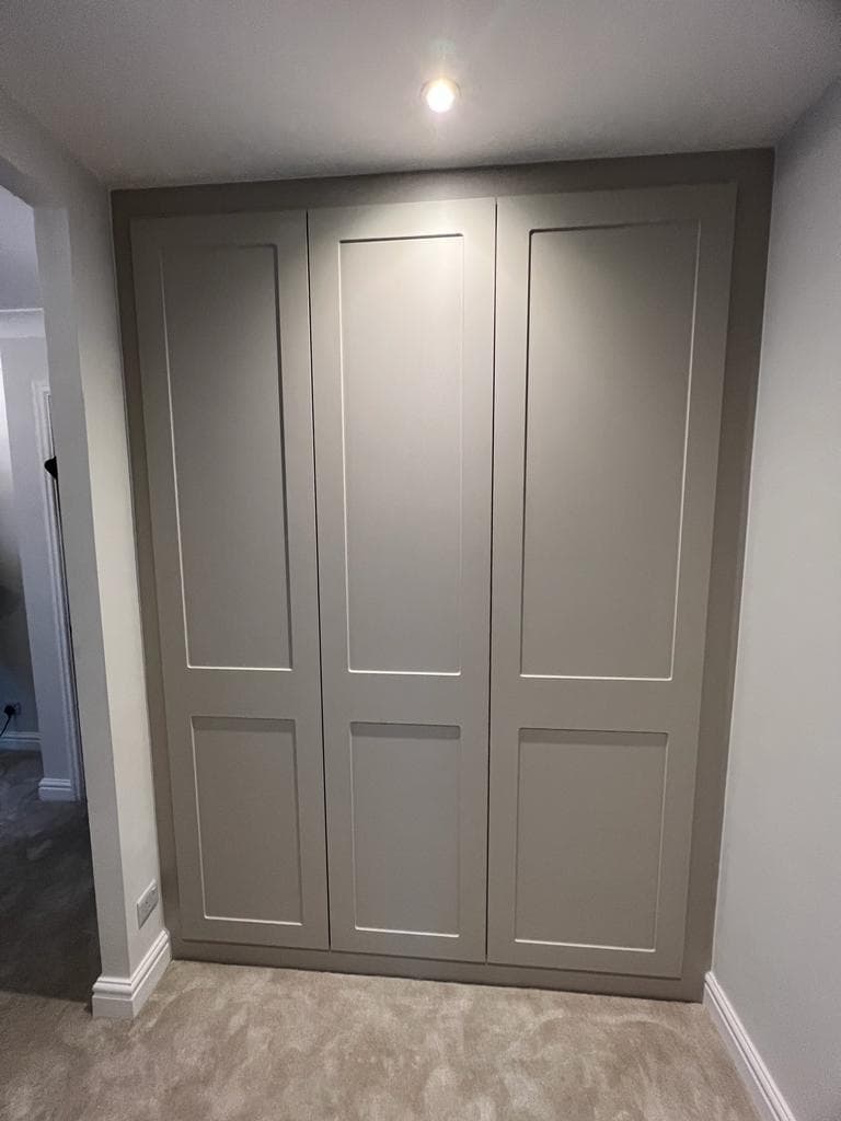 Shaker wardrobe doors cut to match sloped ceiling roof pitch angles