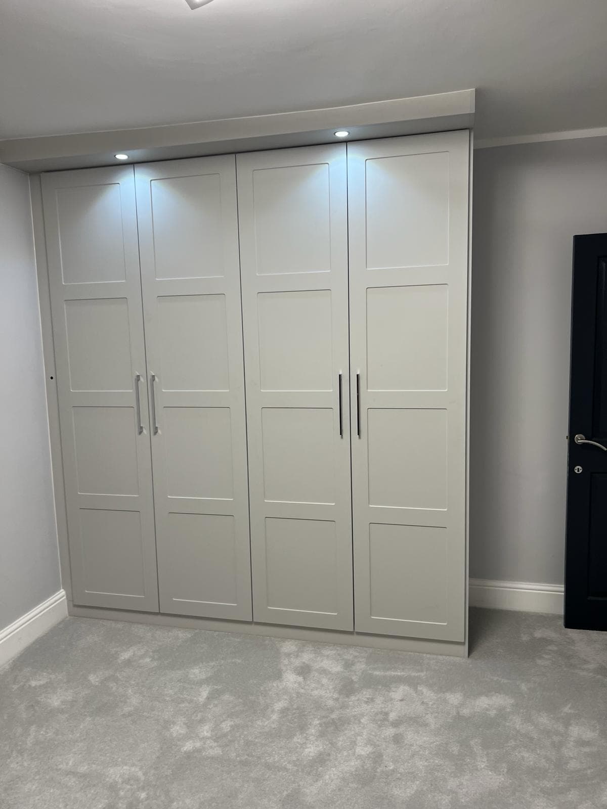 Hand-scribed Shaker wardrobe frame with seamless floor-to-ceiling fit