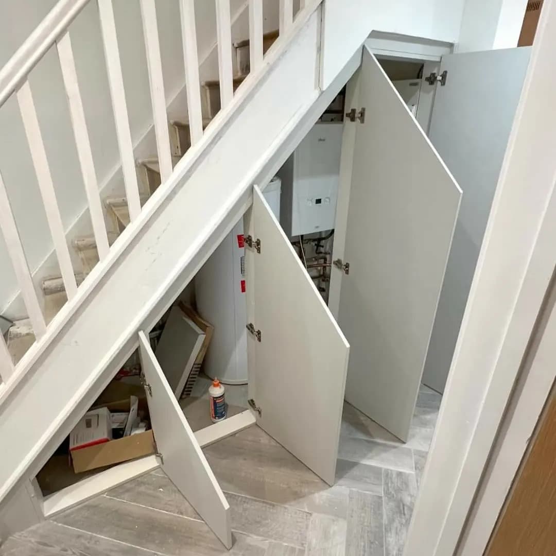 Pull-out under stairs shoe storage in a Manchester home